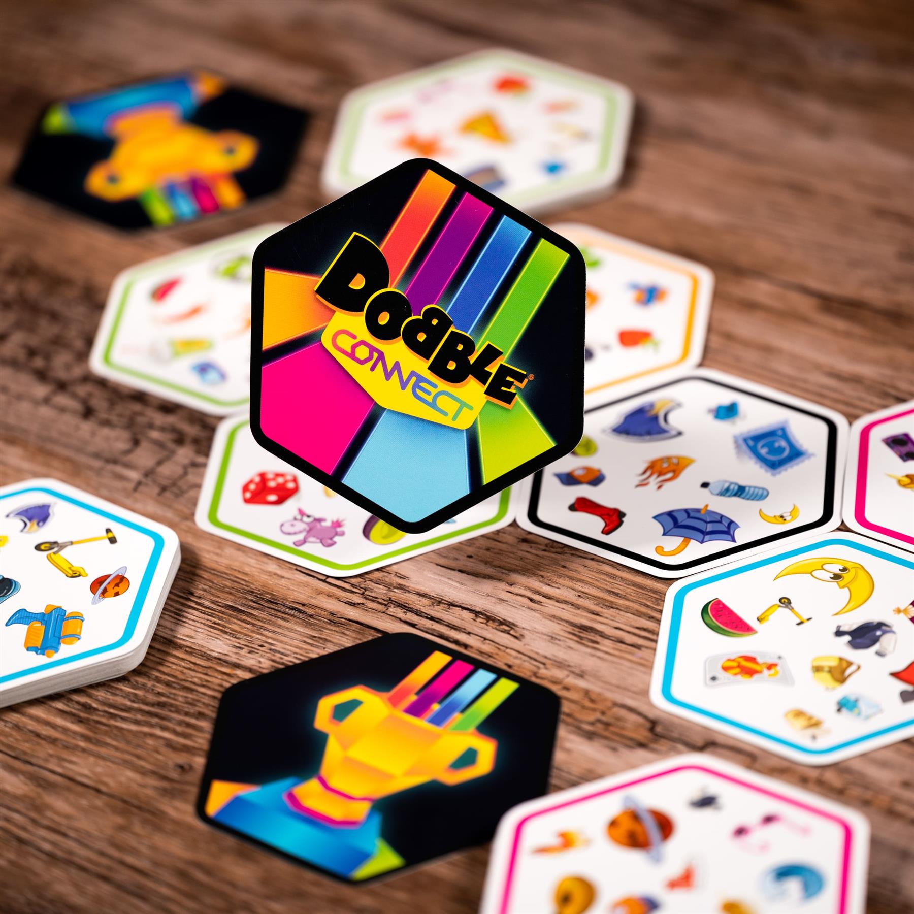 Colorful card game 'Double Connect' on a wooden surface with various cards displayed.